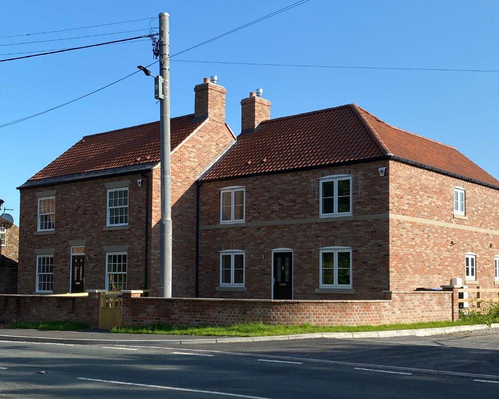 Houses with brick wall